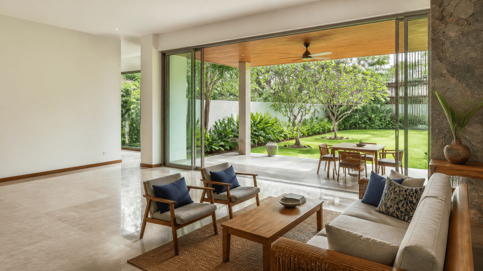 A bright contemporary Colombo living space opening onto a tropical garden