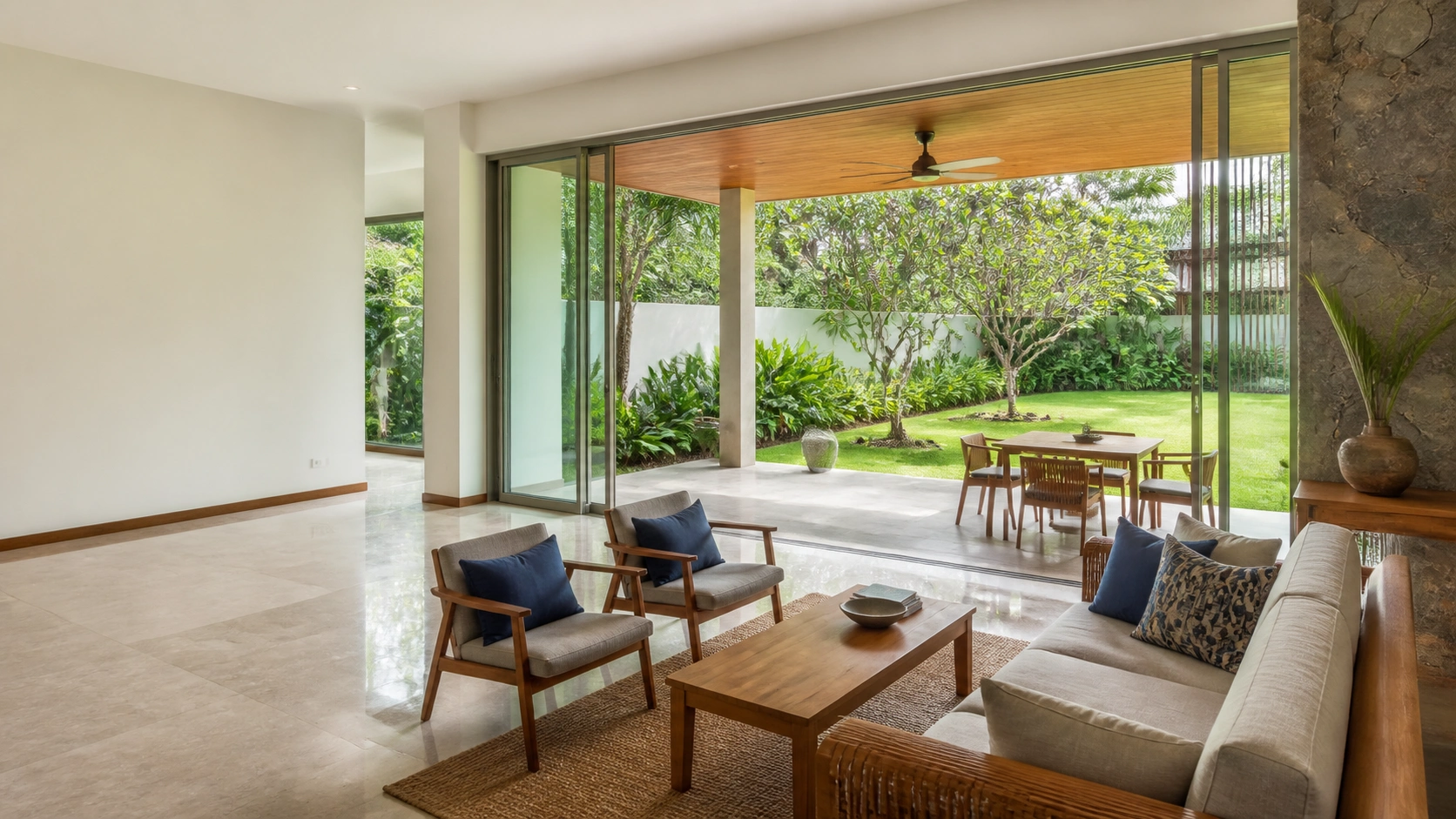 A bright contemporary Colombo living space opening onto a tropical garden